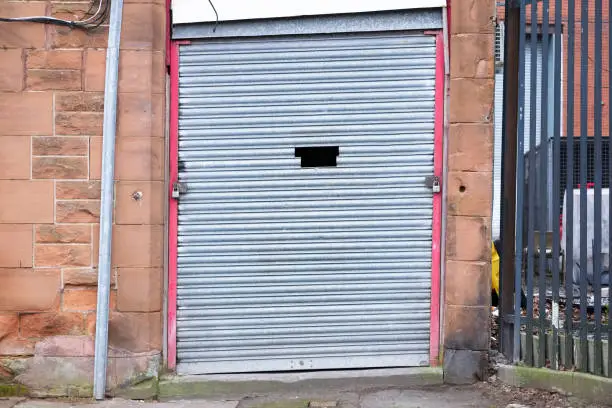 Roller shutter door closed business garage entrance door uk