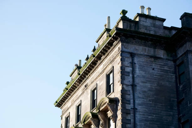istock Chimney pots on old victorian house roof uk 1212063464