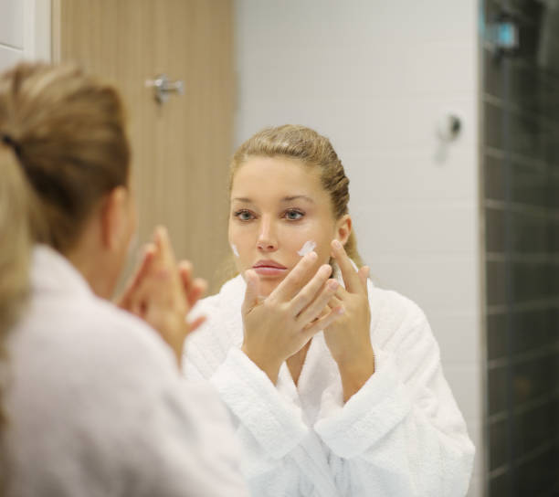 istock Magic anti-aging cream.Applying the cream 1212064291