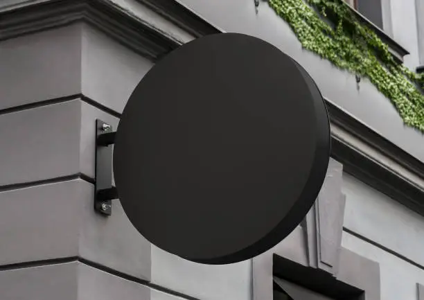 Photo of Blank store signage sign design mockup isolated clear minimal shop template street hanging mounted wall signboard for logo presentation metal cafe restaurant bar plastic badge black white round rectangle retail