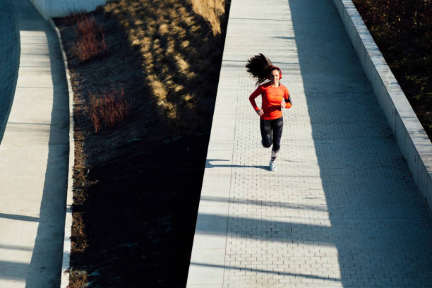 istock Attractive young woman exercising 1212067221