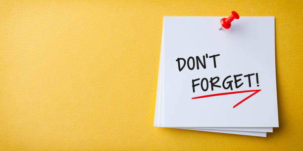 istock White Sticky Note With Don't Forget And Red Push Pin On Yellow Background 1212068162