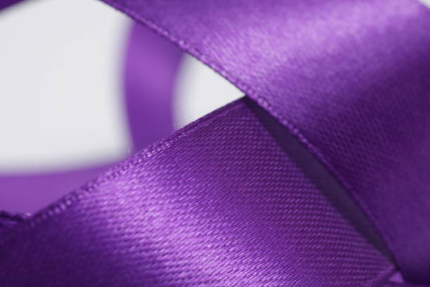 istock Abstract defocused purple satin ribbon for background 1212068175