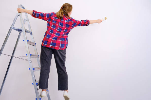 istock Problems with safety at painting high-rise works. Falling off a ladder while paint wall 1212068204