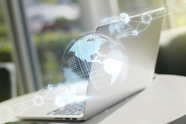 istock Double exposure of robotics technology with world map hologram on laptop background. Research and development software concept 1212069366