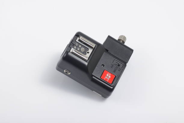 istock Close up shot of black camera flash trigger isolated on white background 1212069480