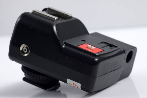 istock Close up shot of black camera flash trigger isolated on white background 1212070773