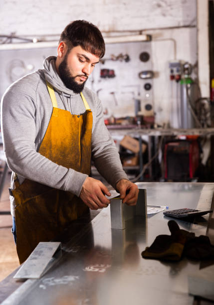 istock Young man  engineer calculation size of material 1212071023