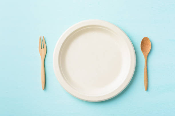 istock Biodegradable plate or Eco friendly disposable plate with wooden spoon and fork 1212071128