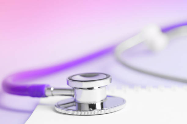 Close-up of a stethoscope with a spiral notebook. Space for copy, shallow depth of field.