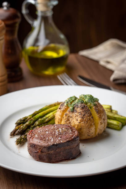istock bacon wrapped tenderloin steak on white plate 1212073211