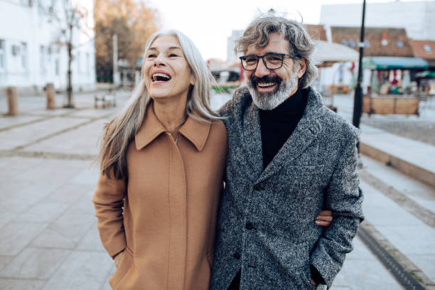 istock Mature couple in a walk having fun 1212075354
