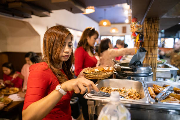 istock Asian women enjoying buffet lunch party 1212076348