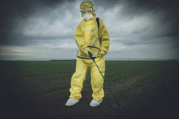 istock Worker spraying toxic pesticides 1212076387