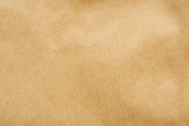 istock Brown paper eco recycled kraft sheet texture cardboard background 1212077064