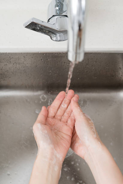istock Asian woman washing hands 1212077543