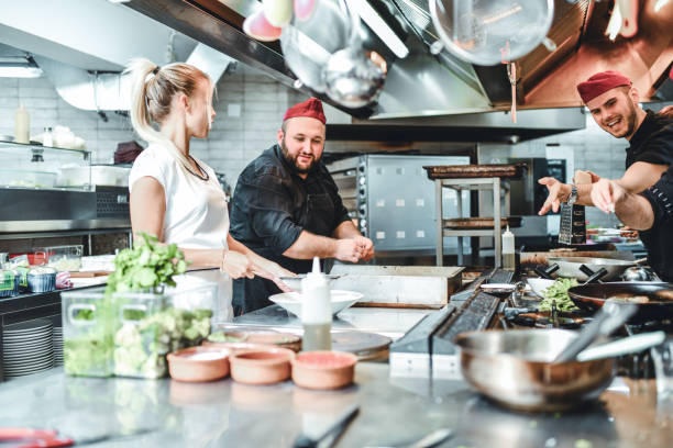 istock Busy Kitchen Team Working On Spices As They Prepare The Food 1212078637