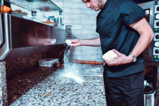 istock Male Baker Ready To Knead Some Bread Dough 1212079187