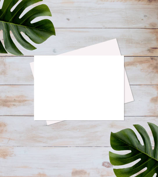 istock Rectangle white card mockup flat lay with leaves 1212080051