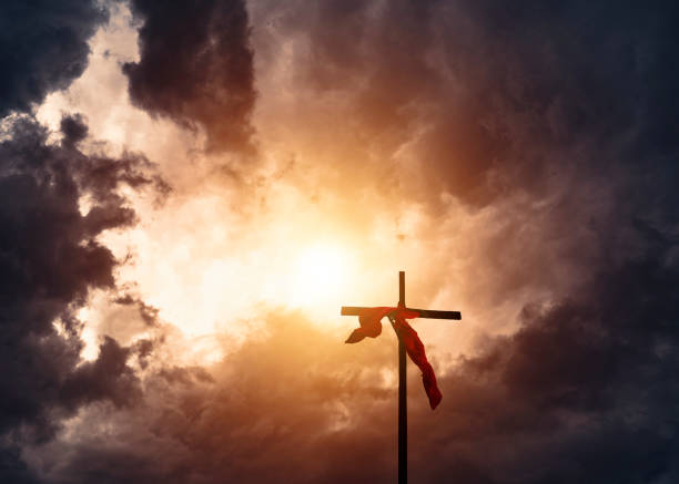 istock Christianity Cross and stormy clouds 1212084057