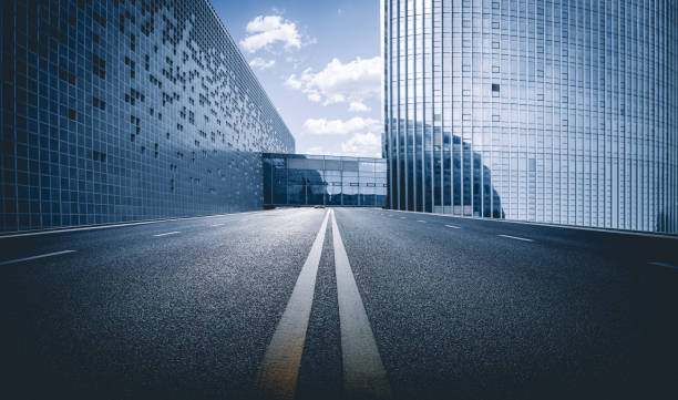 istock Divided highway passing through city buildings, blue nostalgia high contrast 1212085038