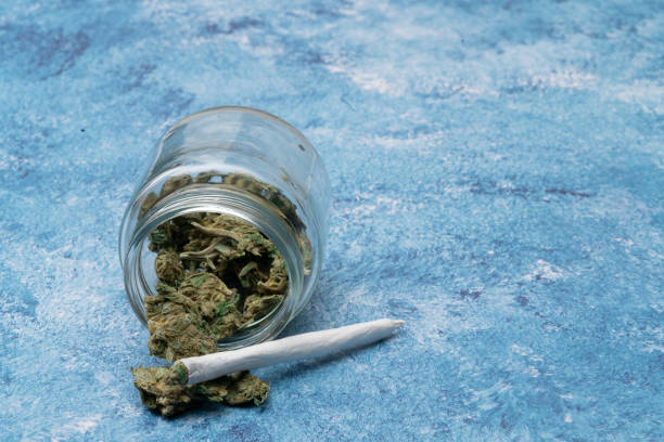 istock Marijuana cannabis Medicinal, weed joint In a glass container, drugs. 1212087123