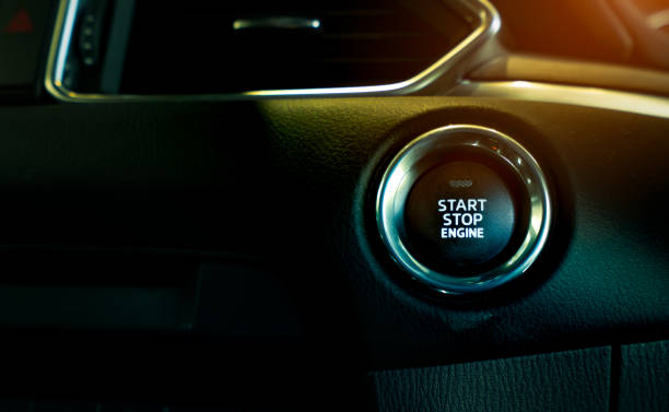 istock Start stop engine button of luxury car. Push up button for start or stop car engine in keyless automobile. Turn key with ignition system concept. Black ignition switch. Car dashboard interior view. 1212088734