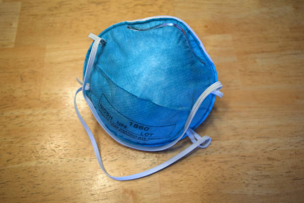 istock Protective Surgical Face Mouth Mask Particulate Respirator To Prevent Infectious Virus 1212088858
