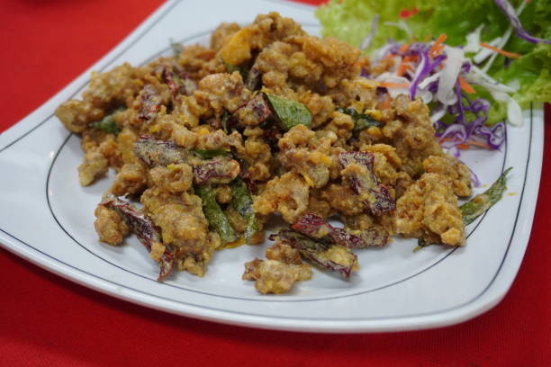 istock Deep Fried Squid with salted egg at Pulau Ketam. 1212091269