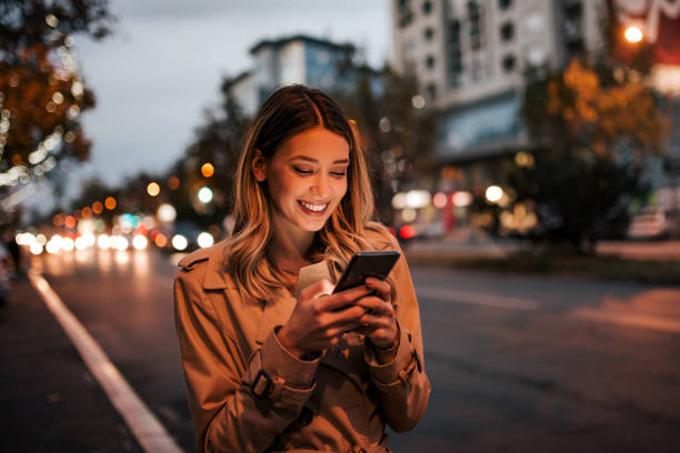 Beautiful woman using smart phone, portrait.