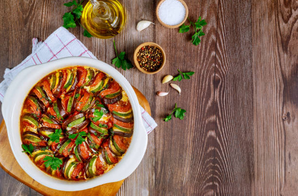 istock Baked vegetable ratatouille with mozzarella cheese in white oven pan. 1212096343