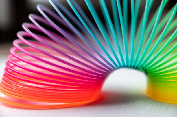istock colorful flexible bouncy plastic spring bent into an arch 1212097146