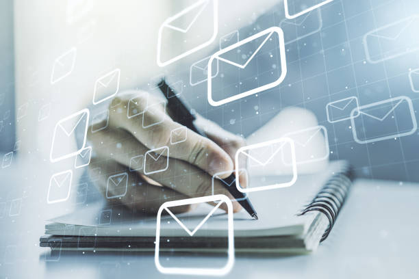 istock Creative concept of postal envelopes illustration with hand writing in notebook on background. Email and communications concept. Multiexposure 1212099336