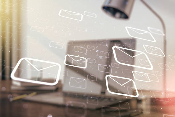 istock Double exposure of postal envelopes hologram on laptop background. Electronic mail and spam concept 1212099462