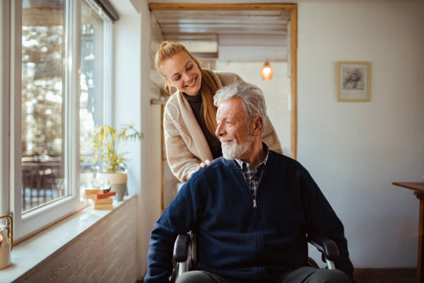 helping her old man - senior adult winter senior women daughter imagens e fotografias de stock