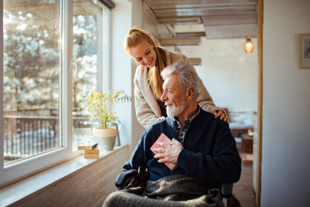 helping her old man - senior adult old nursing home people imagens e fotografias de stock