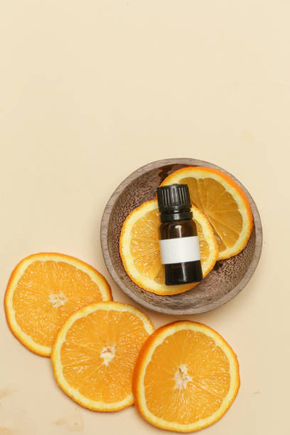 istock Orange  oil, little bottle and lemon slices studio shot 1212101341