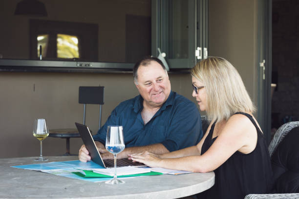 istock Middle Aged Couple Planning Holiday 1212103083