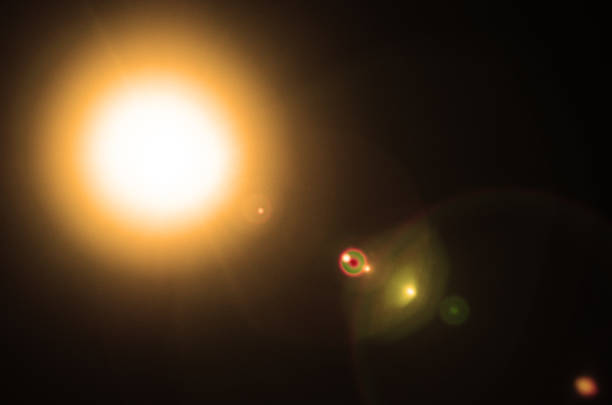 istock Abstract Natural Sun flare or Far star on the black background 1212103710
