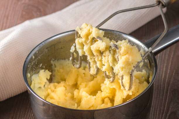 istock Close up view of mashed potatoes in saucepan 1212104734