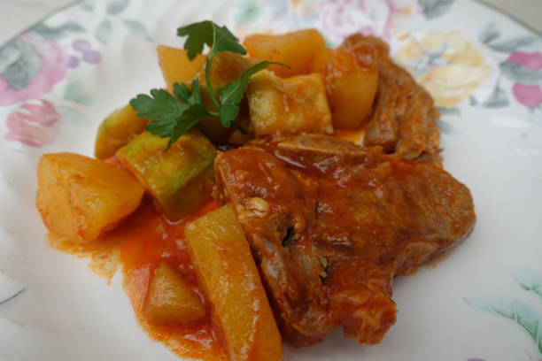 istock Lamb meat stew with potatoes and zucchini 1212107608