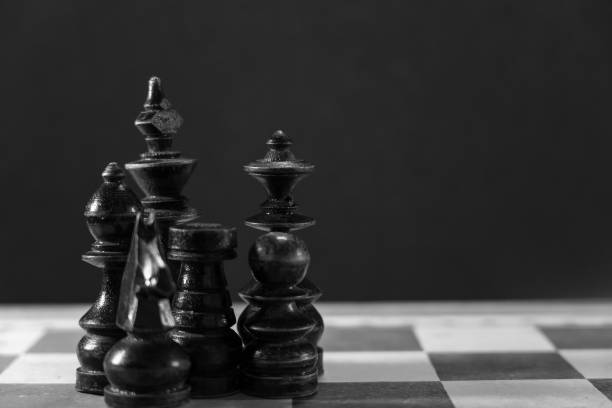 istock Image of Chess Pieces on Board for Game; black and white style 1212108778