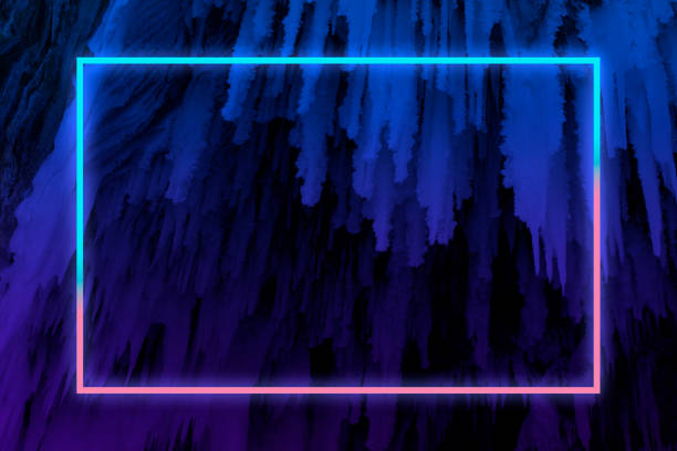 istock Ice stalactite in blue and pink gradient tones with neon light frame, winter background 1212110979