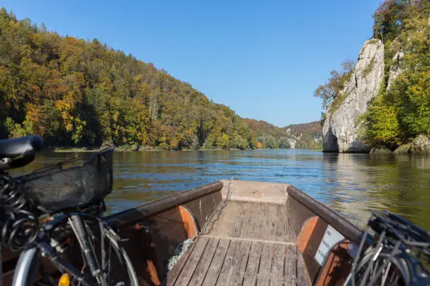 Weltenburg, Bavaria / Germany - Oct 14, 2019: View from a wooden boat cruising at the danube (Donau). Close to the so-called "Donaudurchbruch" (narrow canyon). Feeling of freedom and adventure.