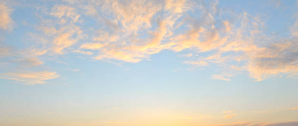 istock Pink cirrus clouds on a blue sky. 1212115573