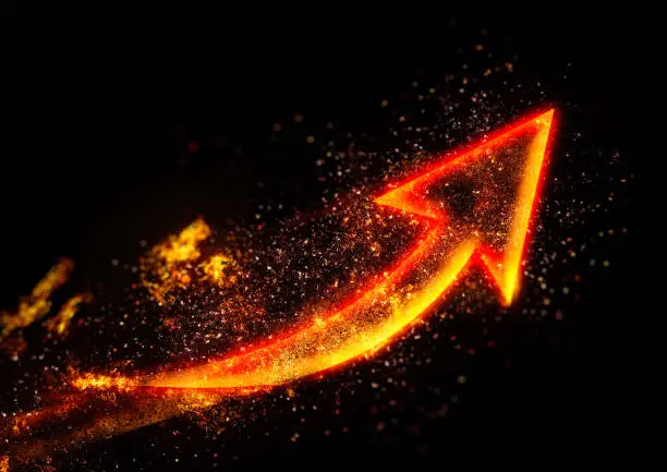 Photo of Abstract fire arrow floating in the dark