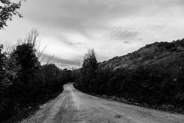 istock A mountain road below clouds at sunset after a storm 1212122426