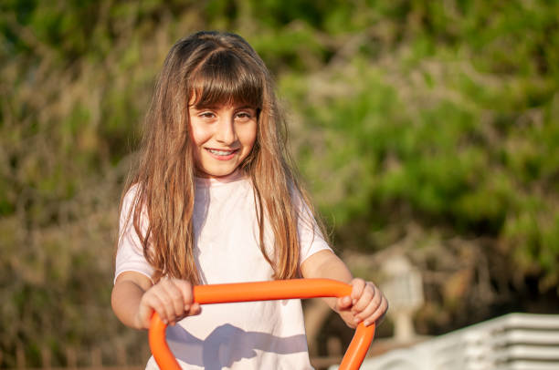Turkish cute girl happiness on seesaw