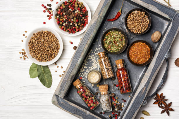 istock Mix bright spices and herbs in small bowls and bottles 1212123554