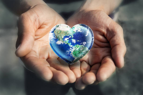 Hand holding Heart Shape Earth, Love Green Environment  and Earth Day concept stock photo